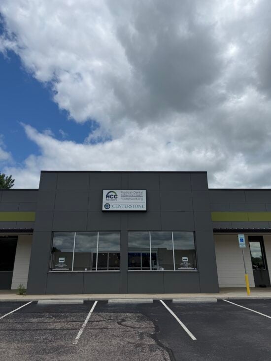 Front exterior of the Centerstone and HCC Network building with parking spaces and an accessible parking sign.