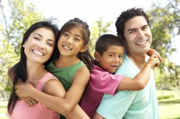 parents holding kids up on their backs