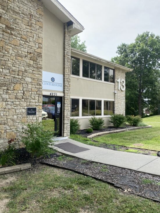 Stone-faced Centerstone building entrance marked 4231, with a sign for the George W. Norman, Jr. Recovery Center.