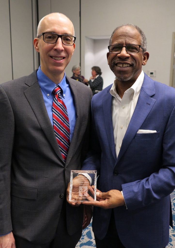 Ben Middleton, Chief Operating Officer in Tennessee (right), accepted the honor, thanking HAPI volunteers and Centerstone Peer Support Services staff and clients for their administrative, therapeutic and creative efforts.