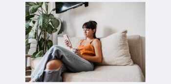 girl on couch on phone