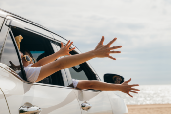 hands out the car window