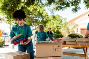Group of volunteers sorting boxes of donations