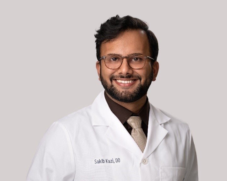 Portrait of Sakib Kazi, D.O. in a white lab coat