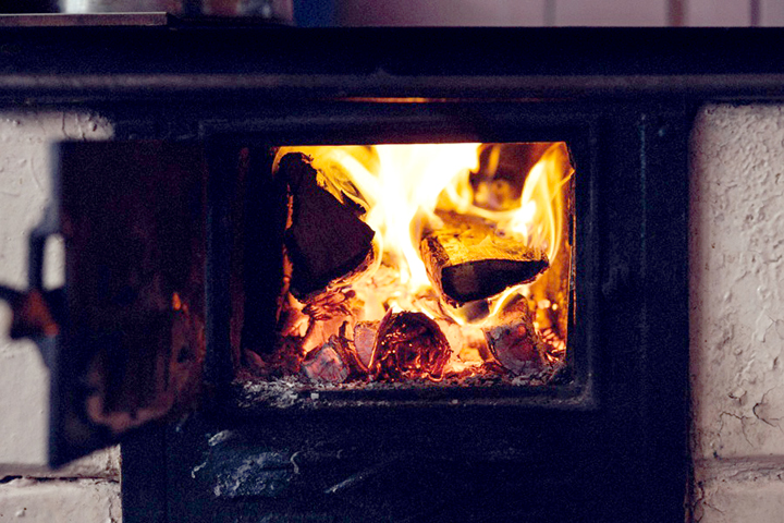 photo of wood burning fireplace