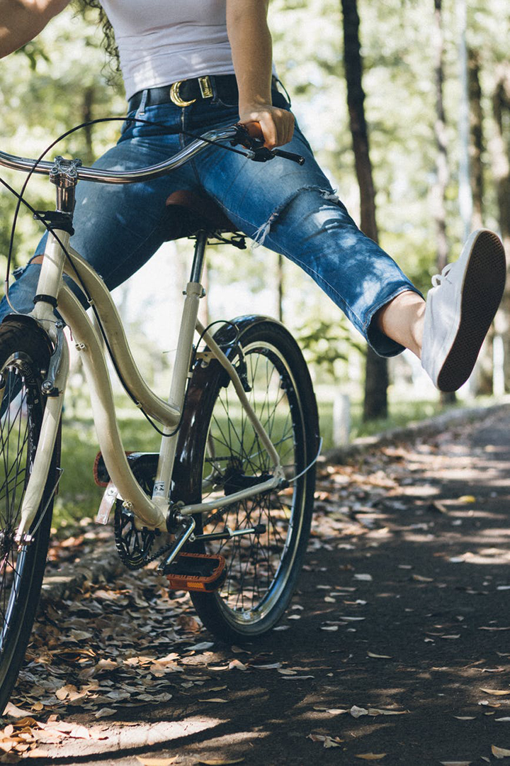 Woman enjoying a bike ride in the park