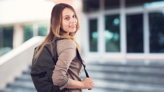 School stairs, girl with backpack